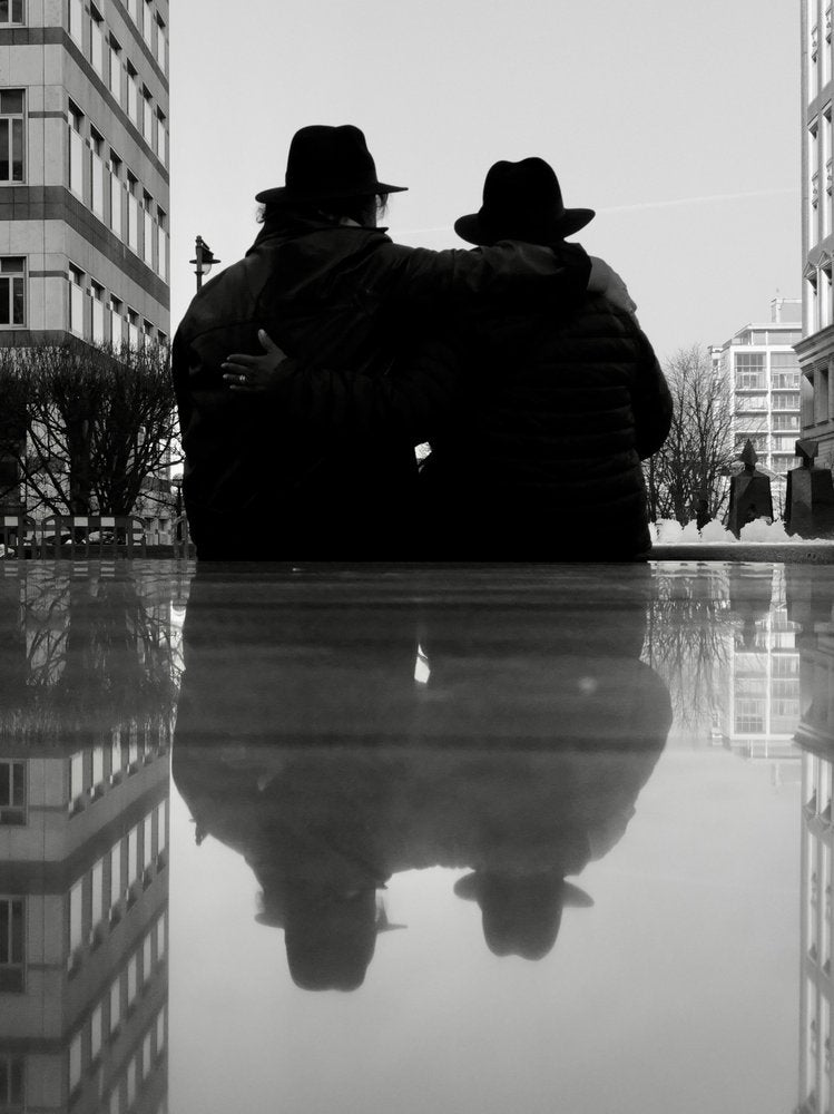 Hatted Couple Reflection