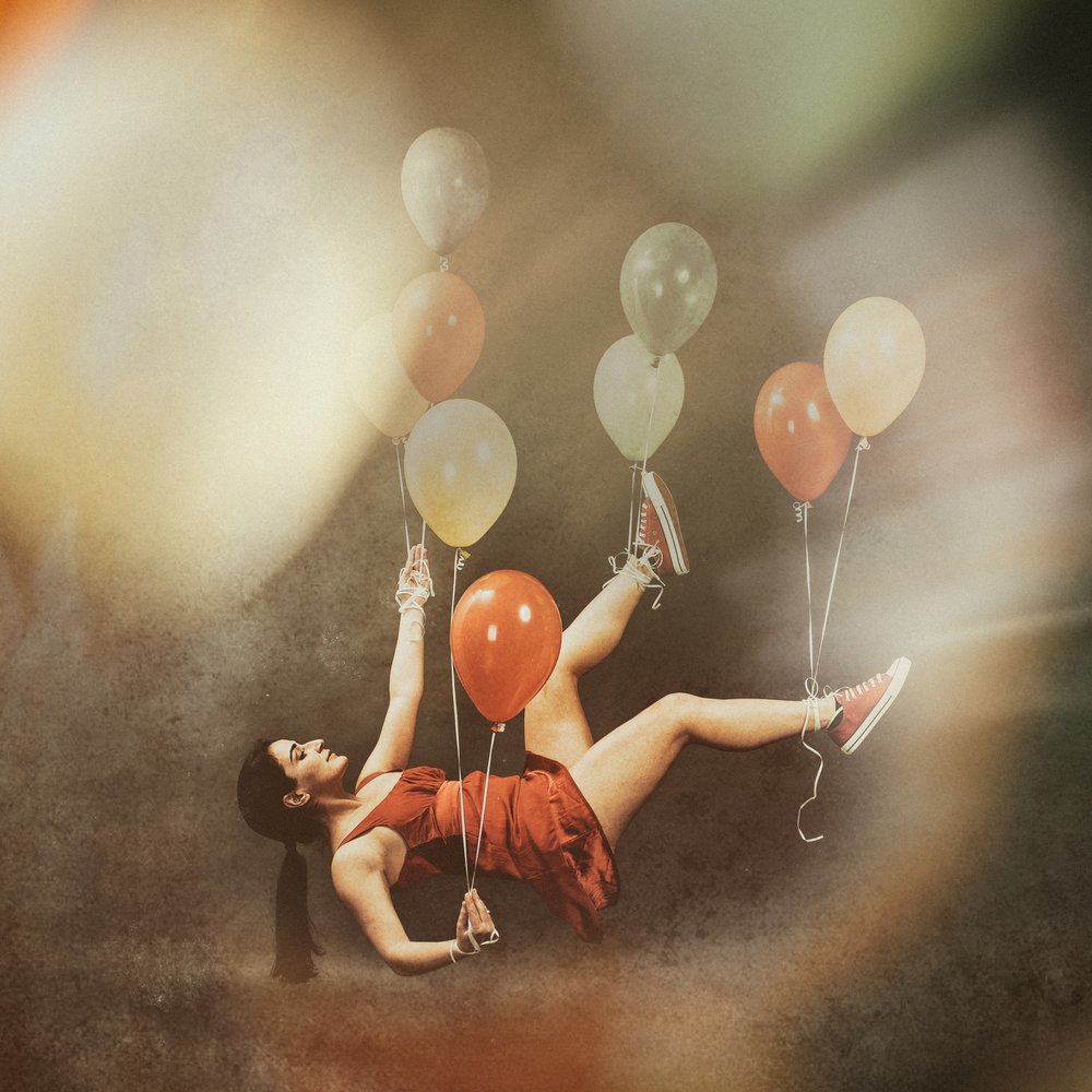 Floating Dreamer with Balloons