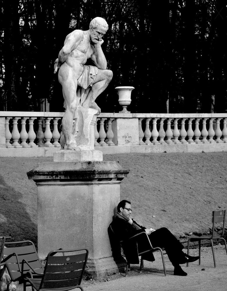 Reflective Man and Statue