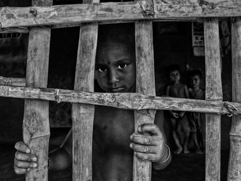 Innocent Gaze Through Bars