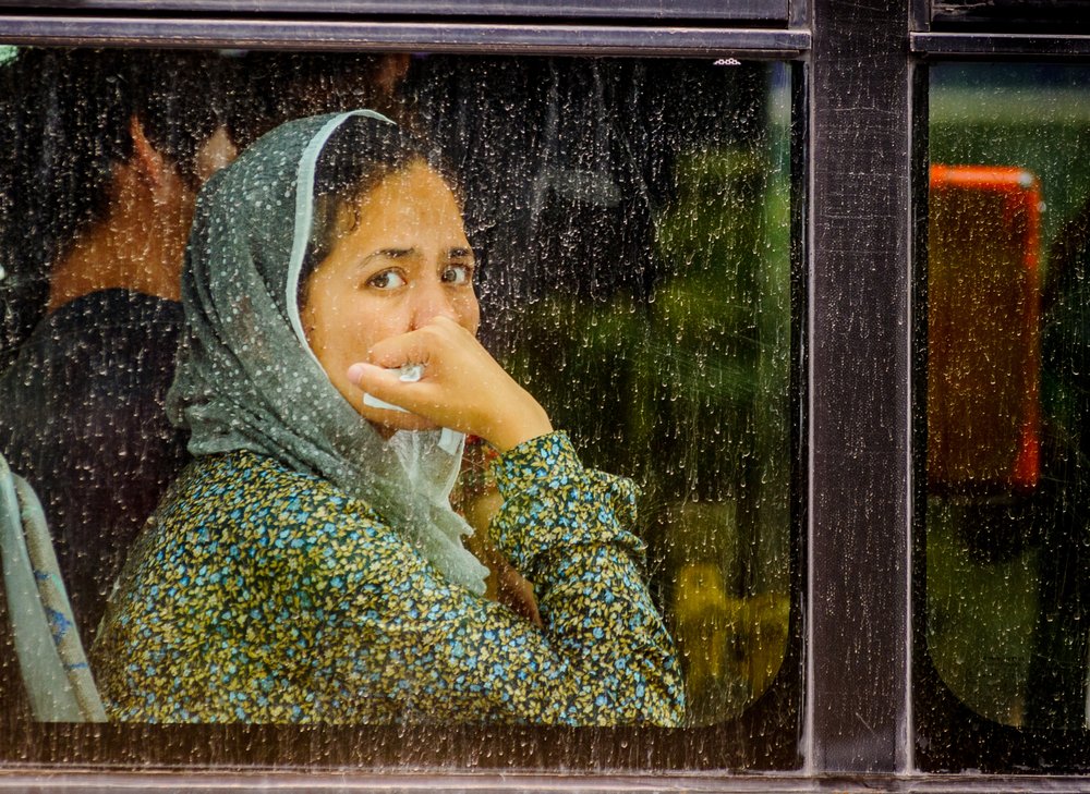 Woman Through Rainy Window