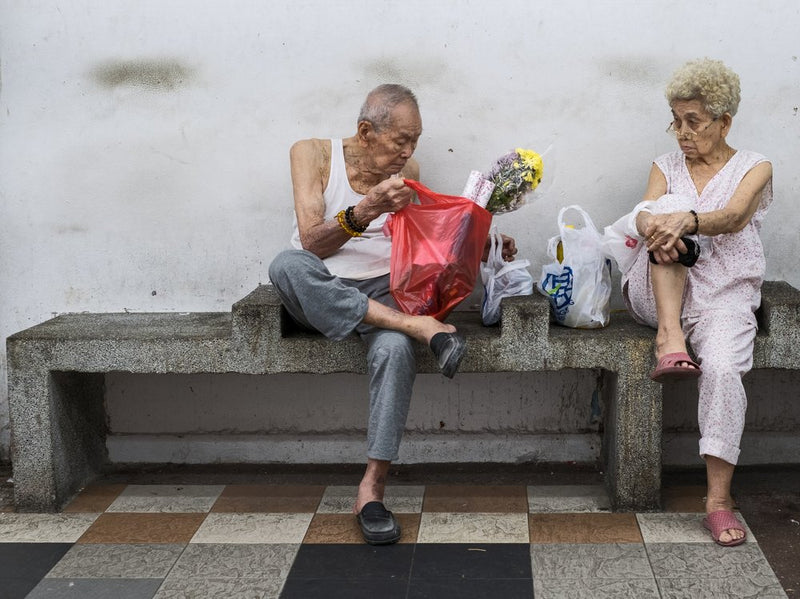 Elderly Couple With Flowers