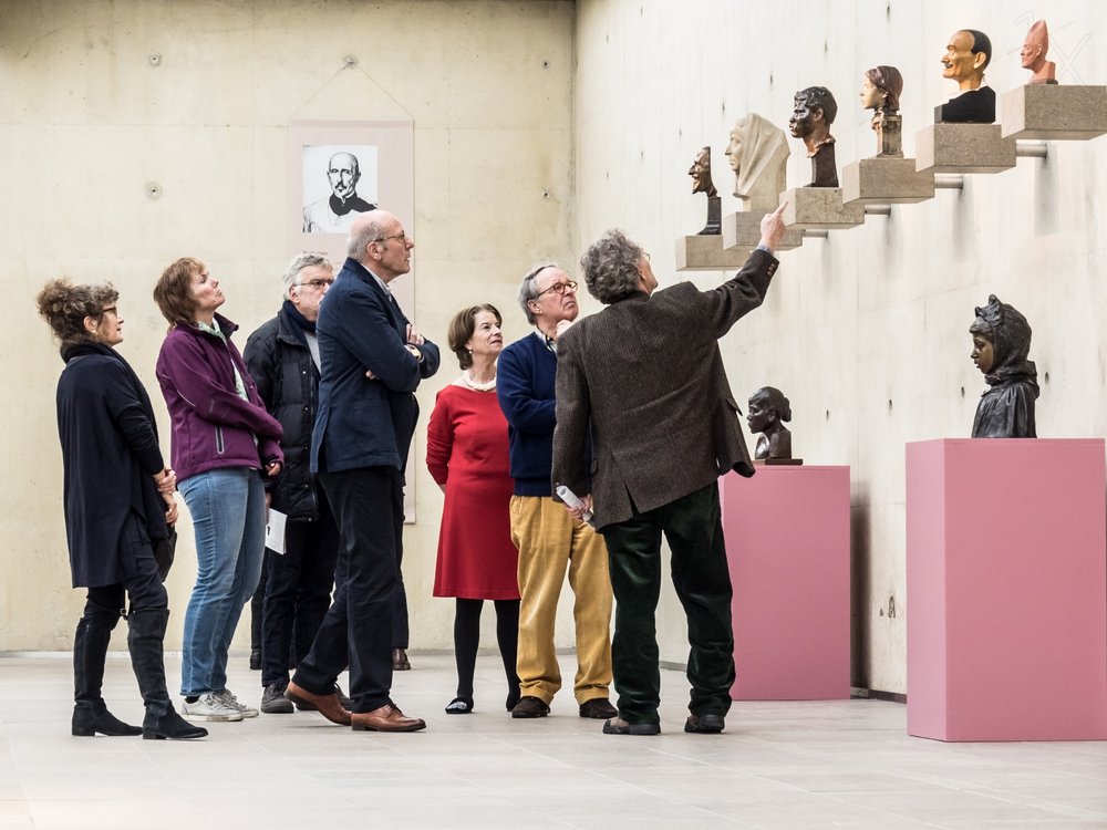 Museum Visitors Viewing Art