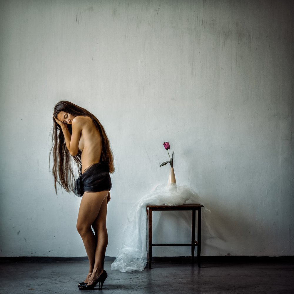 Pensive Woman and Rose