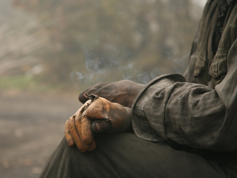 Worn Hands and Smoke