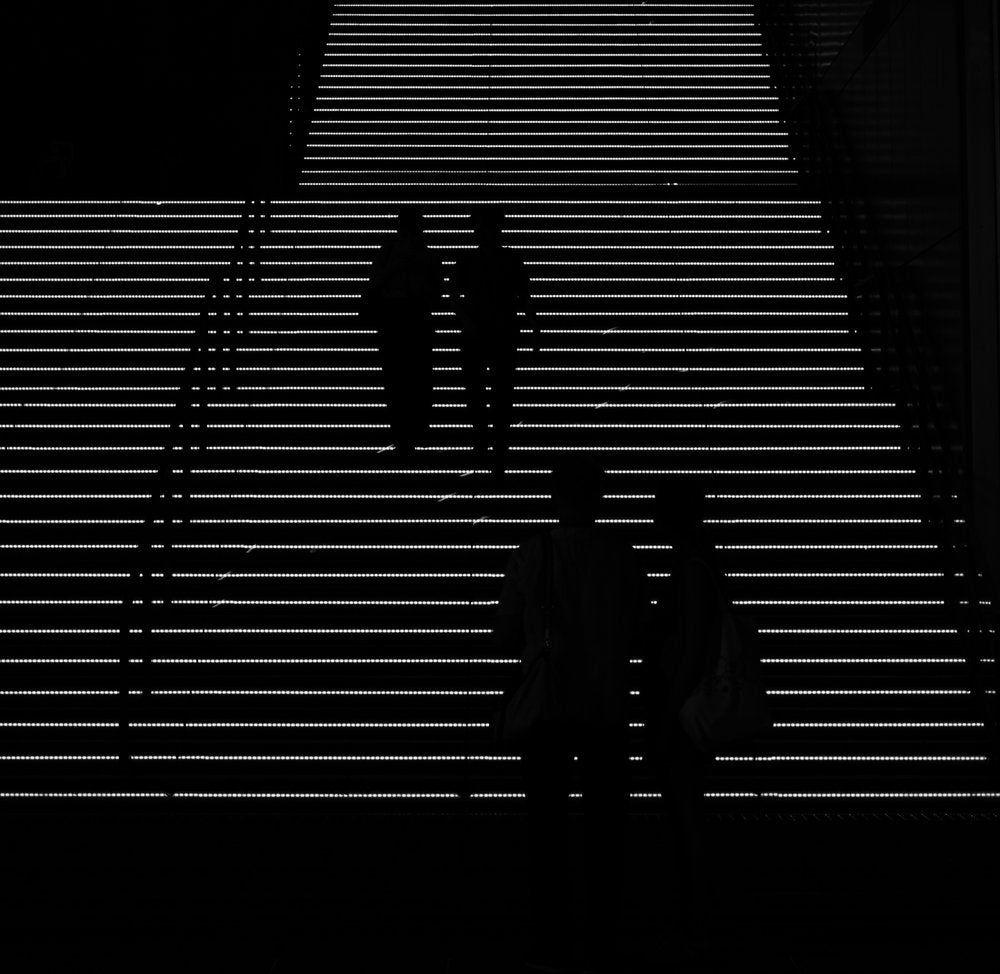 Silhouettes on Glowing Stairs