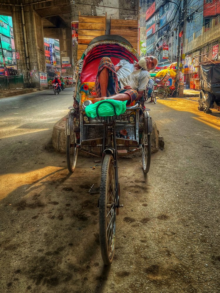Resting Rickshaw Puller