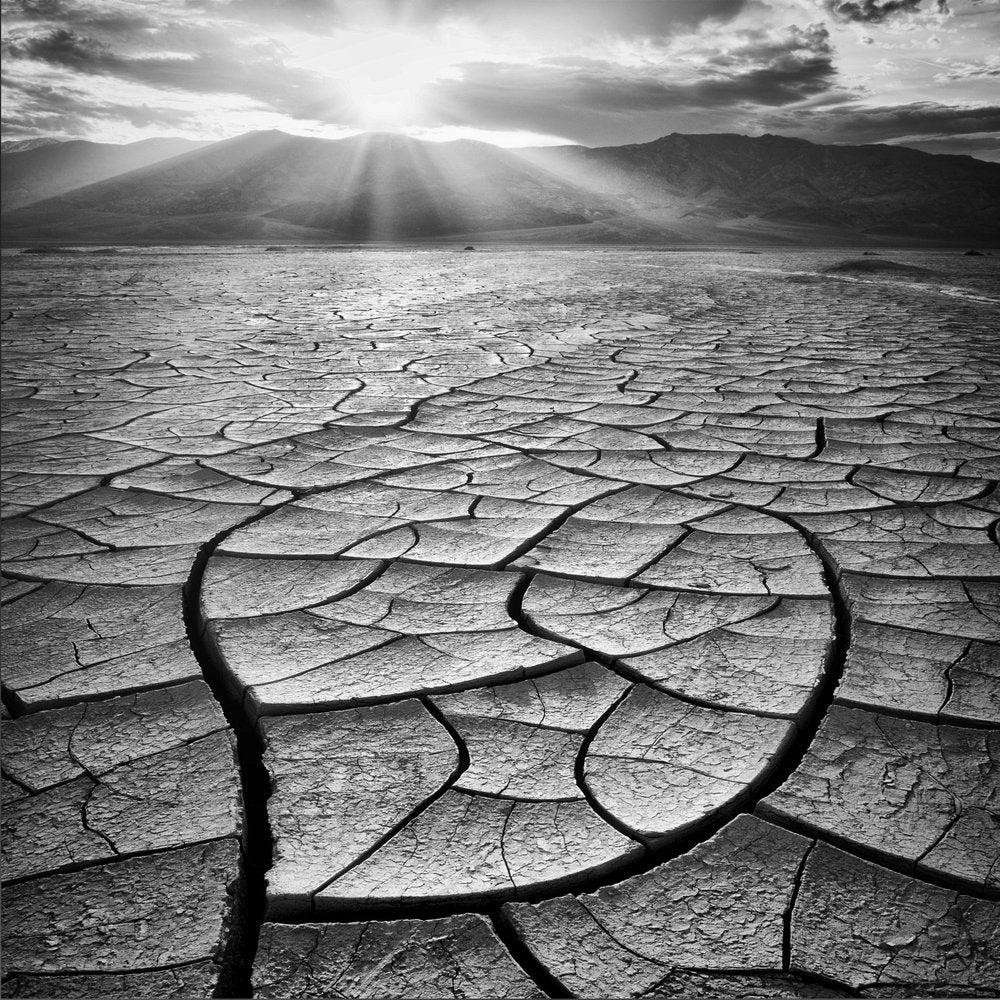 Sunbeams Over Cracked Earth