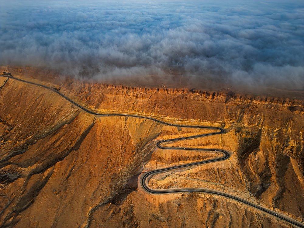 Winding Road Above Clouds