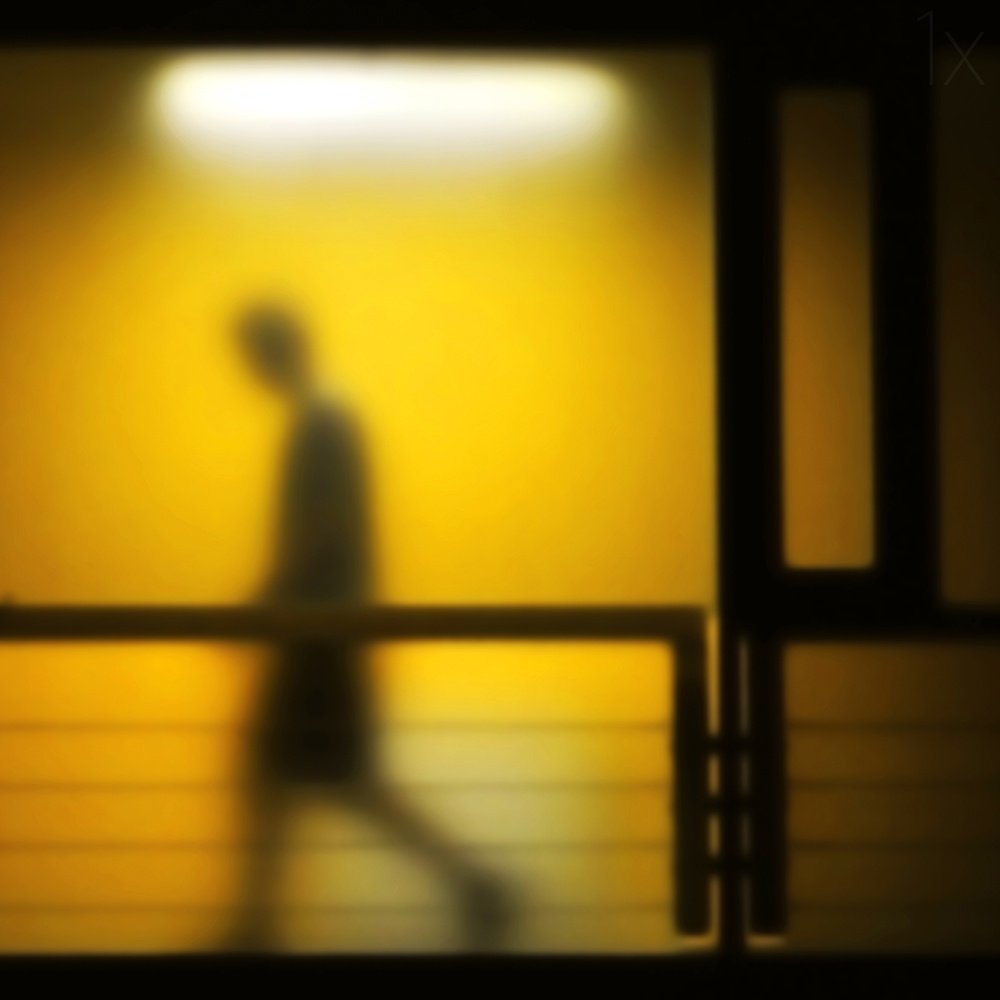 Solitary Figure Yellow Light
