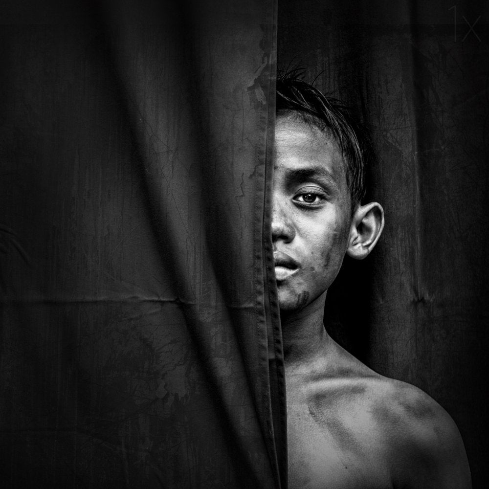 Boy Behind Curtain
