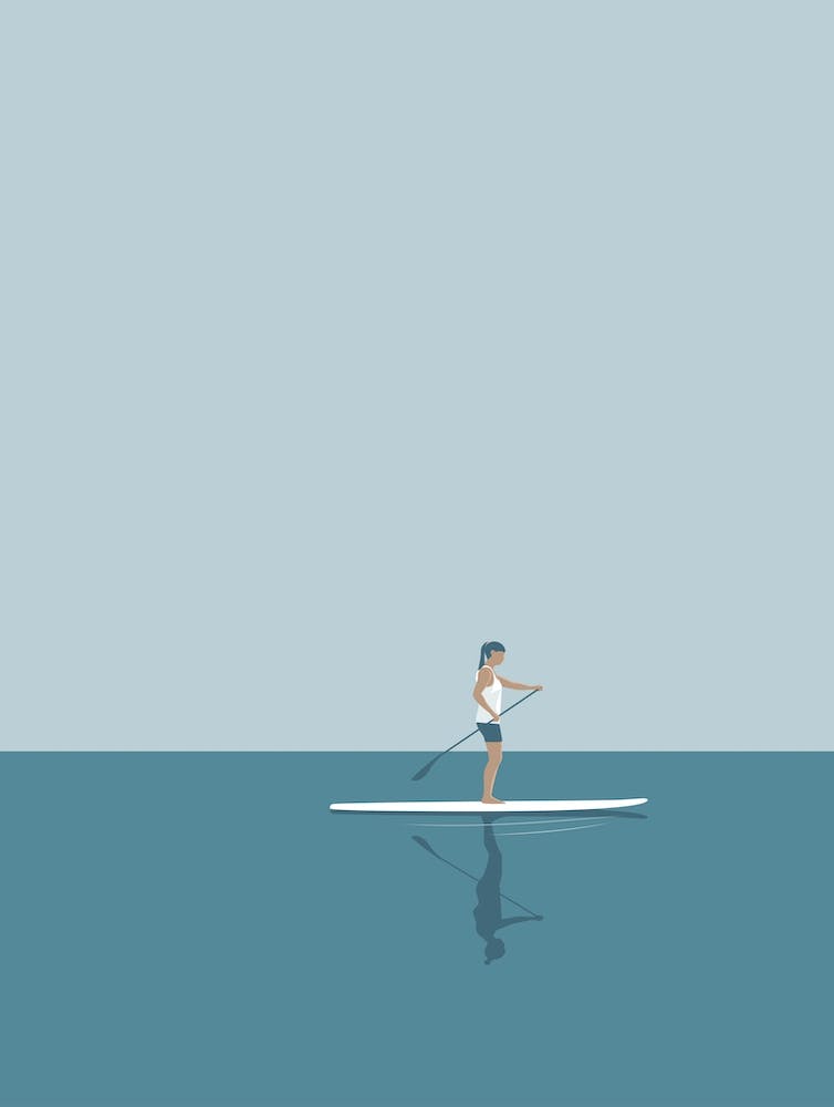 Stand up paddle boarding girl