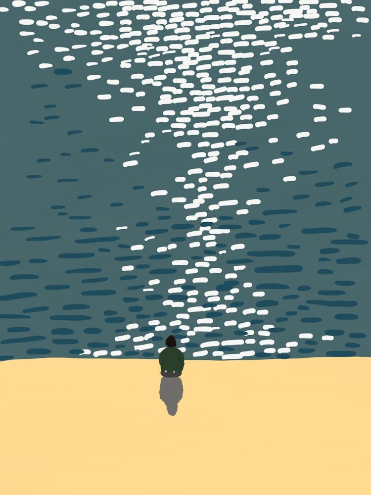 Man Sitting On The Beach