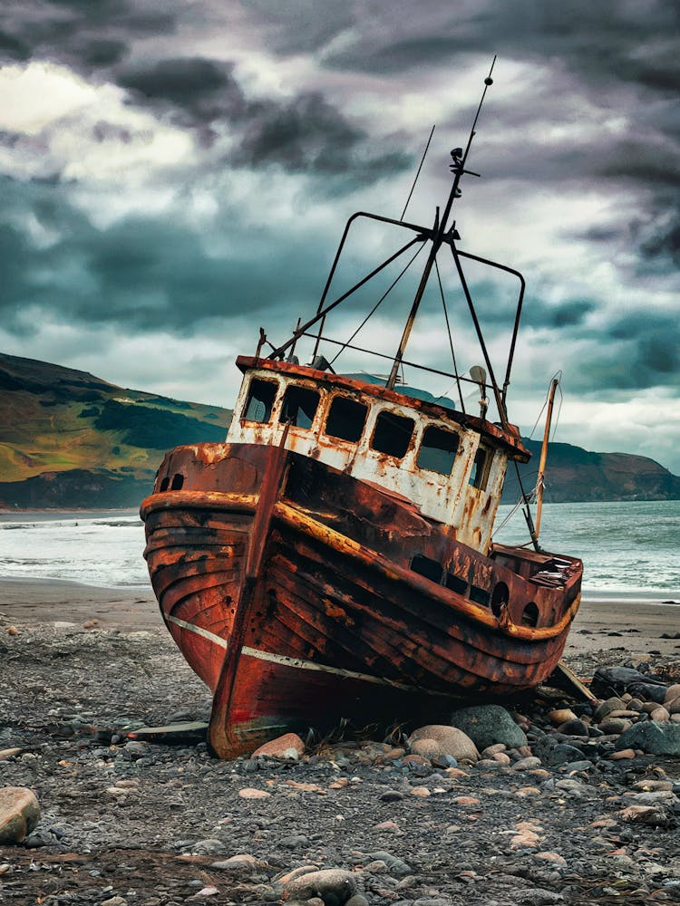 Abandoned Boat On The Beach