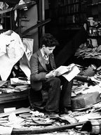 Young Man Reading A Book After Bomb Raid, Vintage Black and White Old Photo