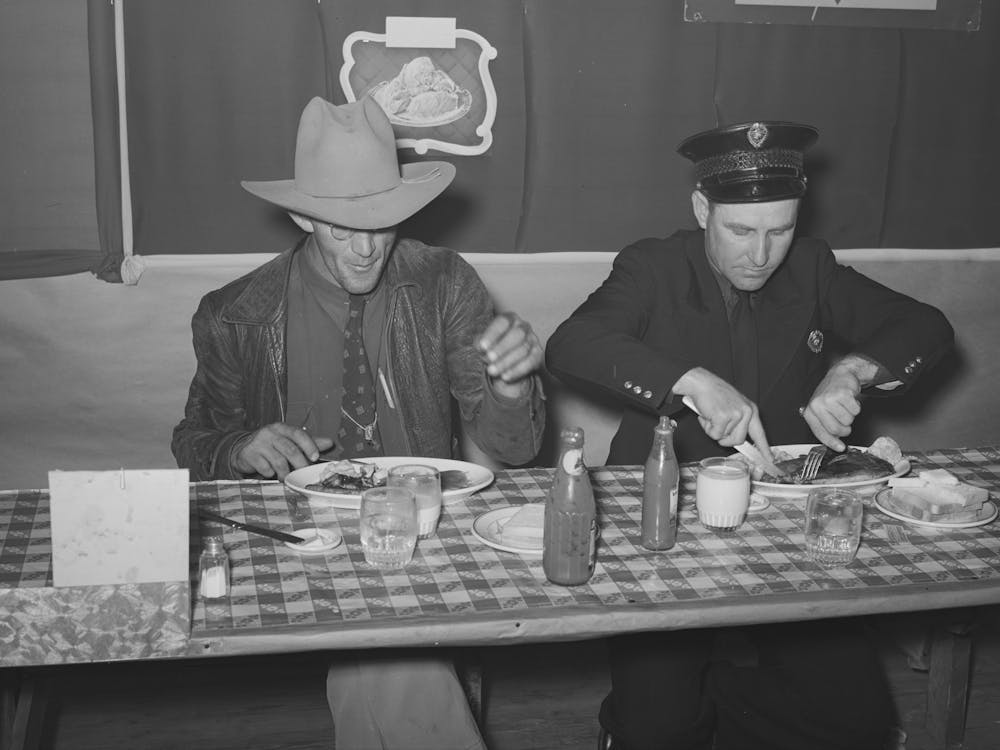 Eating Lunch At A Restaurant On The Grounds Of The San Angelo Fat Stock Show, San Angelo, Texas By Russell Lee