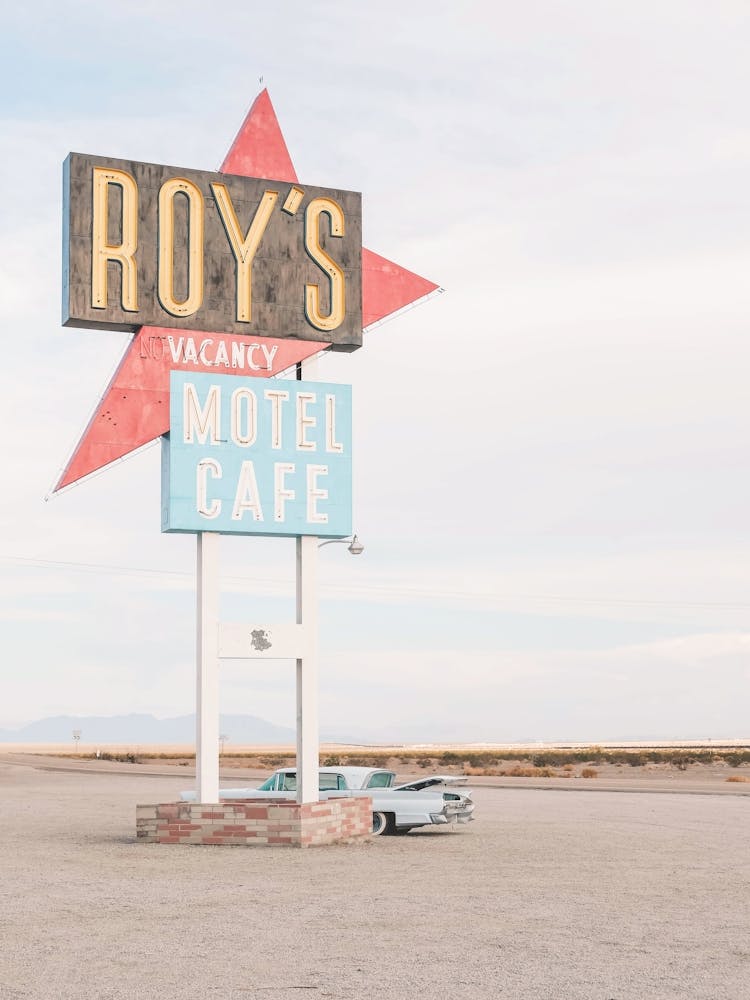 Route 66, USA I Vintage retro neon and American car at Roy's Motel Cafe in the California desert to the minimalist geometric photography pastel summer aesthetic of a travel trip to the West Coast countryside
