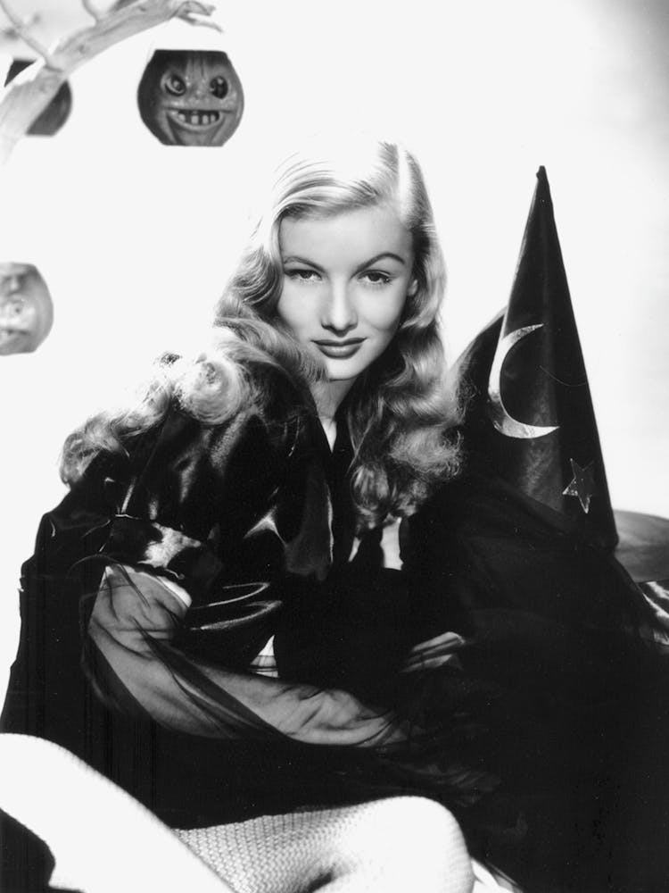 Beautiful Pin Up Blond In Black Witch Costume