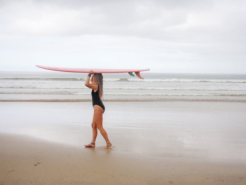 Surfer Girl On The Beach