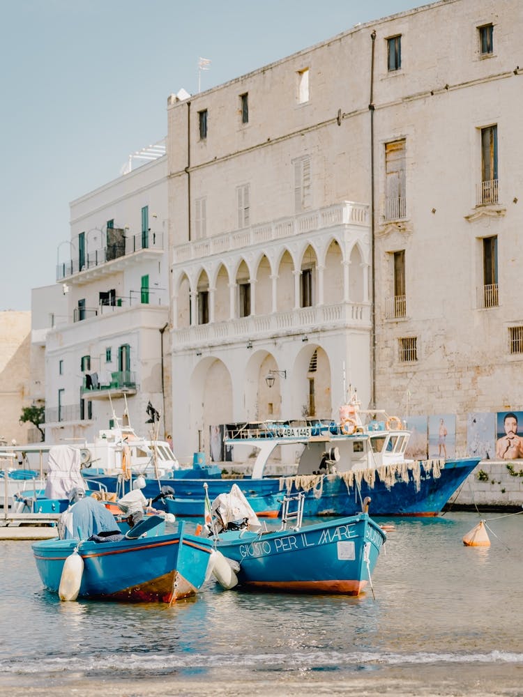 Blue Fishing Boats In The Harbor of Monopoli, Puglia in Italy - travel photography