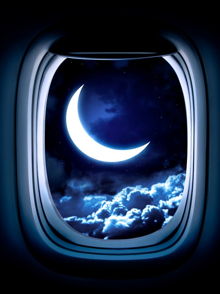 Moon Through The Window Of An Airplane #6