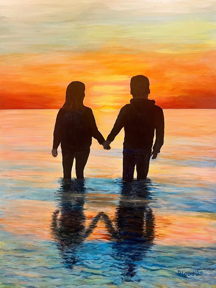 Couple Holding Hands At Sunset