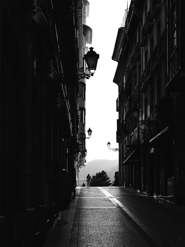 Woman Walking In The Street, Black And White St Sebastian, Spain