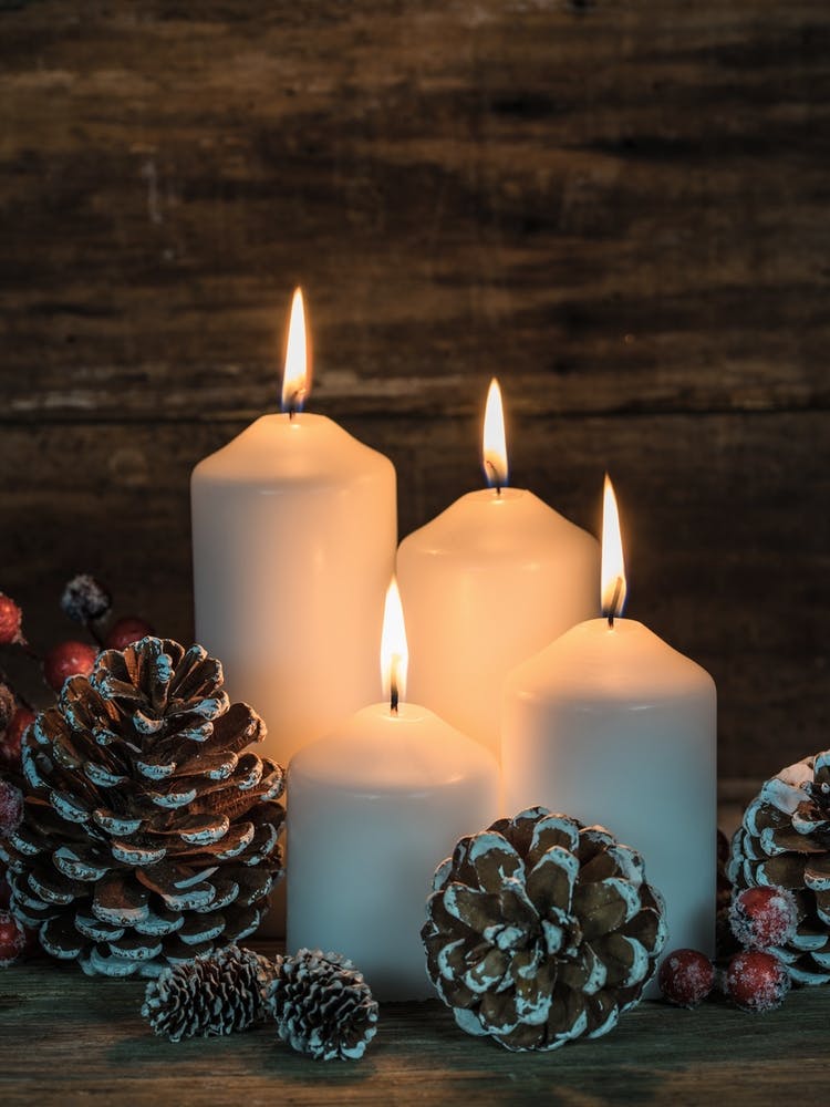 Christmas Candles On A Wooden Table
