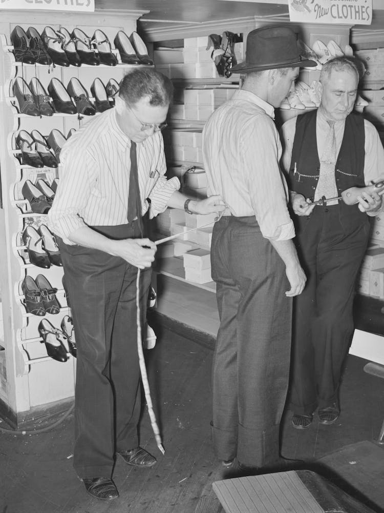 Clerk Measuring Customer For Trousers, San Augustine, Texas By Russell Lee