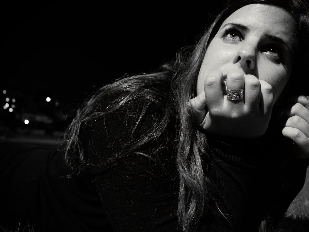 Woman In Thought And Looking Up