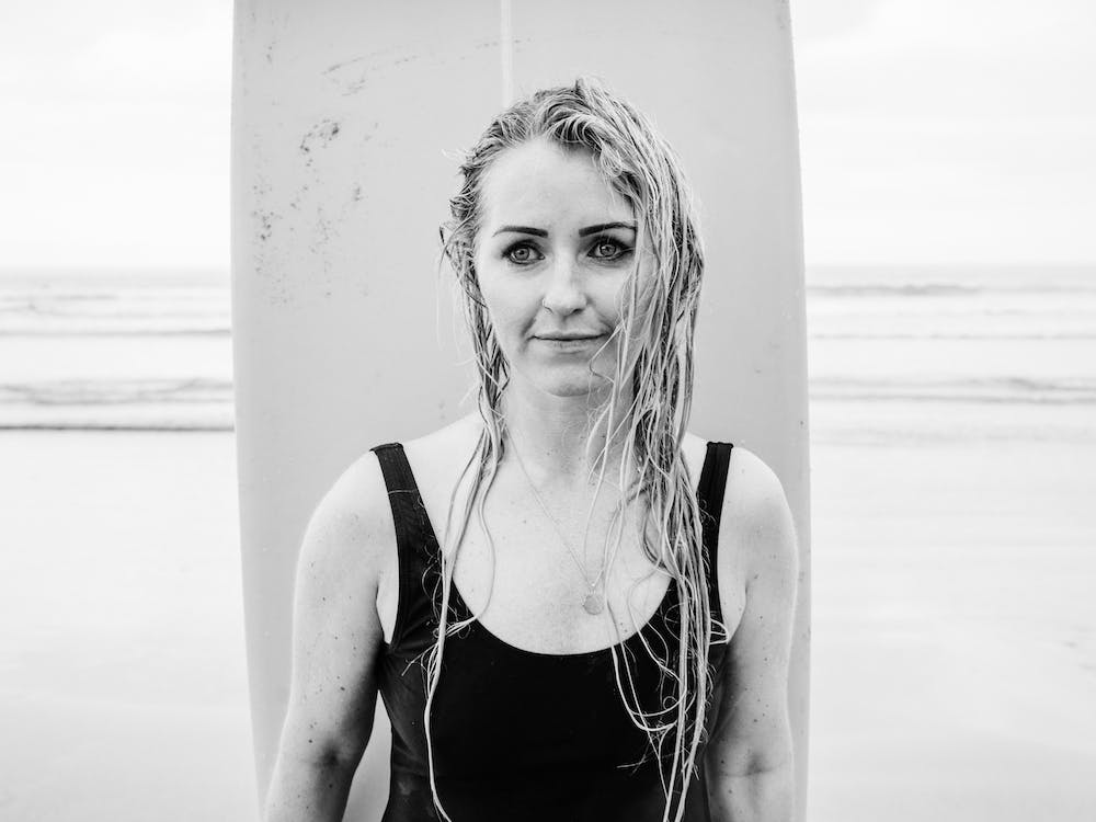 Portrait Of A Woman With A Surfboard