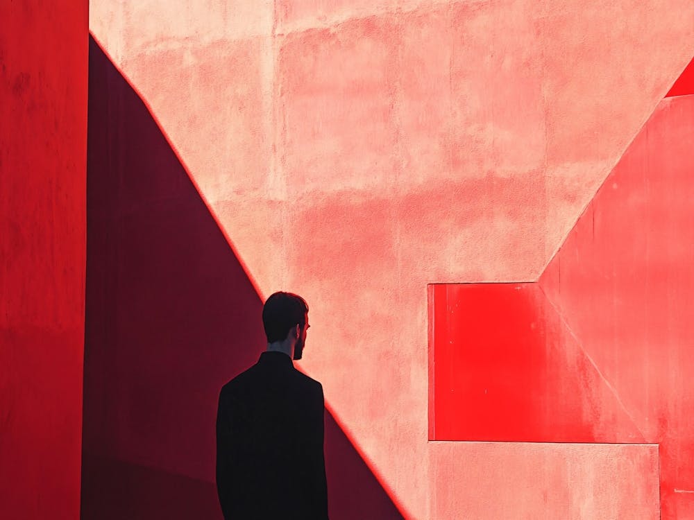 Man In Front Of Red Building