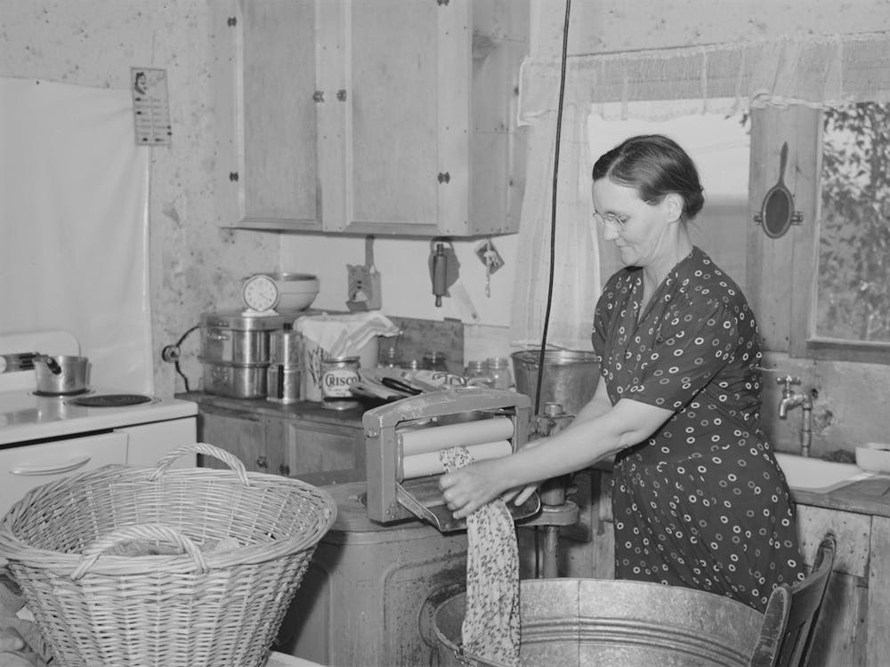 Mrs, Botner, Wife Of Fsa (Farm Security Administration) Rehabilitation Borrower, Wringing Laundry In Electric Wringer