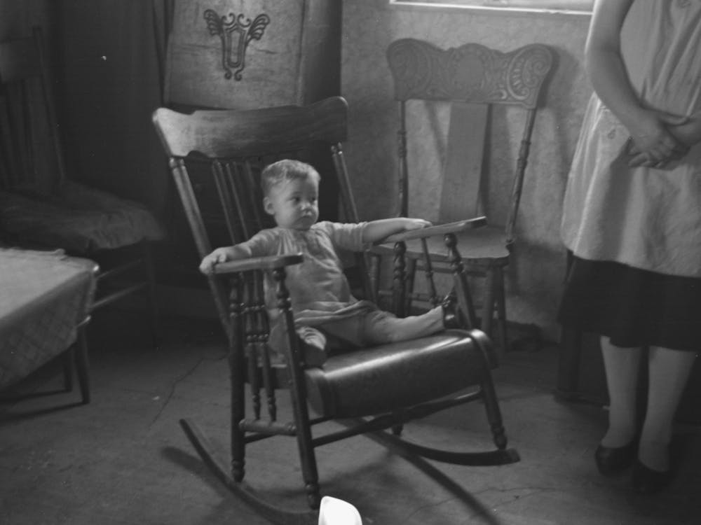 Untitled Photo, Possibly Related To One Of L H Nissen S Children In Rocking Chair Nissen Shack Near Dickens, Iowa