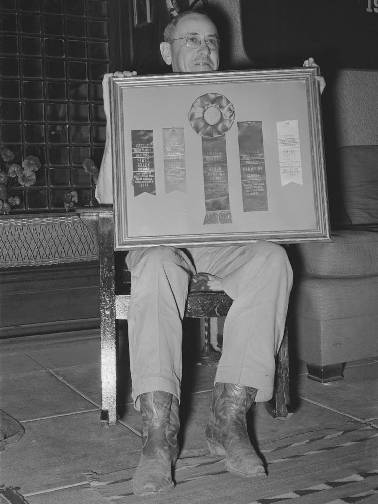 Mr, Henry Fletcher, Owner Of The Walking X Ranch, Displaying Awards Won By His Cattle, Marfa, Texas By