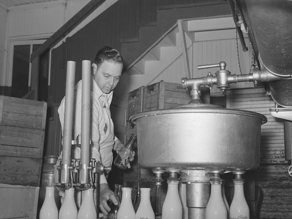 Filling Milk Bottles At Creamery, San Angelo, Texas By Russell Lee