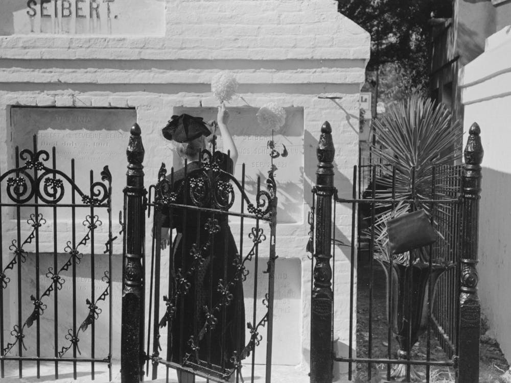 Woman Decorating Family Burial Vaults In Cemetery At New Roads, Louisiana On All Saints Day By Russell Lee