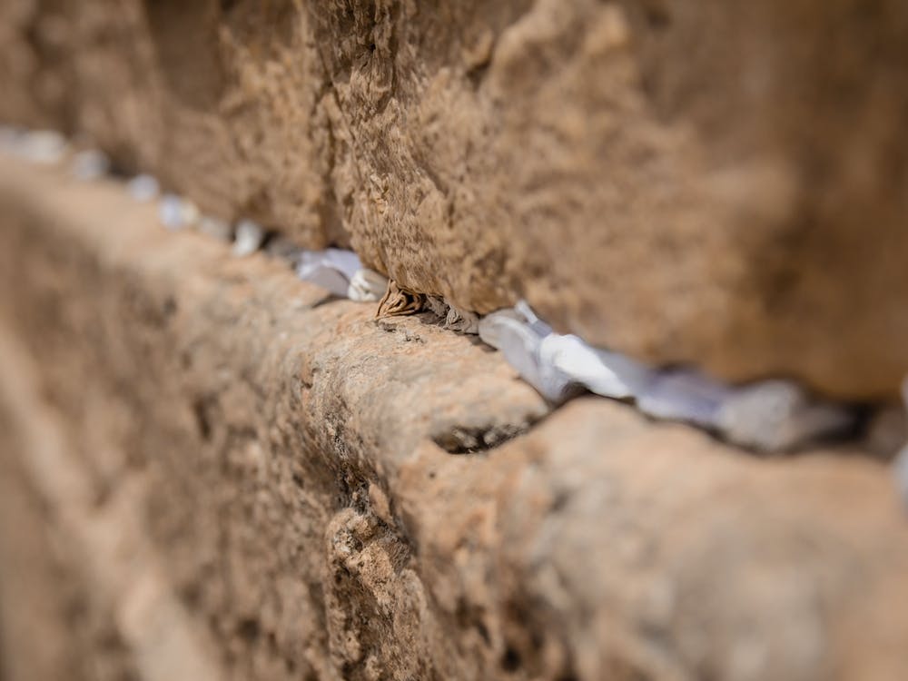 Notes To God In The Cracks Between The Bricks Of The Western Wall In The Old City Of Jerusalem Israel