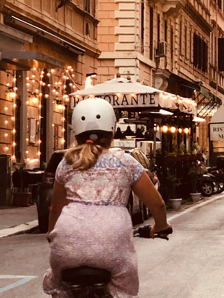 Woman Riding A Bike In Rome