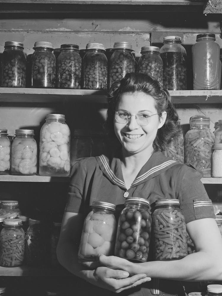 Mrs, Lee Wagoner With Home Canned Fruits And Vegetables, She And Her Husband Farm On The Black Canyon