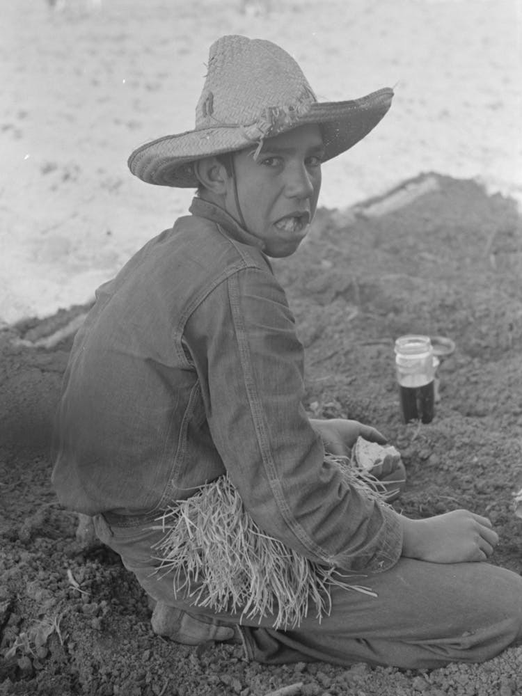 Untitled Photo, Possibly Related To Young Mexican Boy, Carrot Worker, Eating Second Breakfast In Field Near