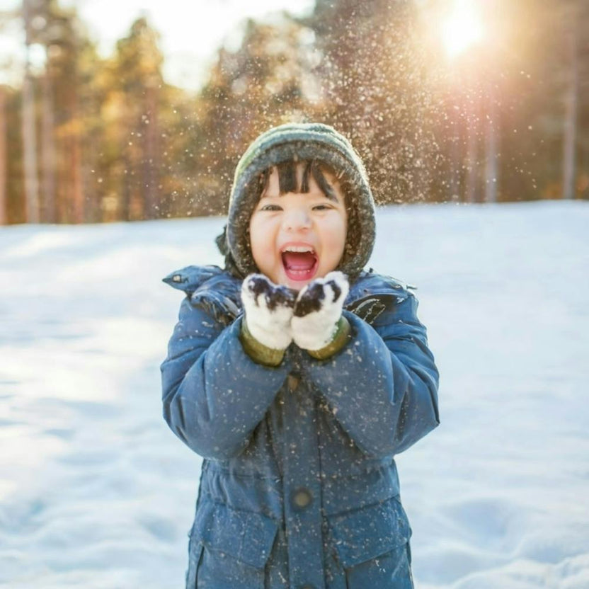 Happy Child In The Snow