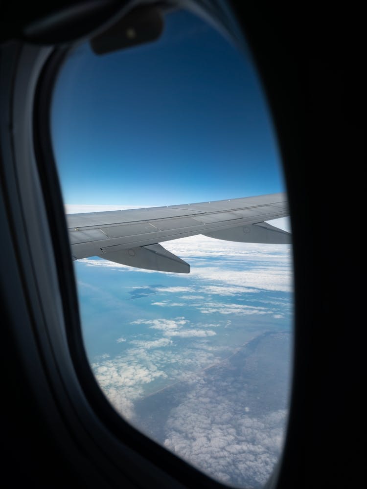 Window seat, coastal airplane view of Ile d'Yeu - France coast - ocean travel photography by Christa Stroo Photography