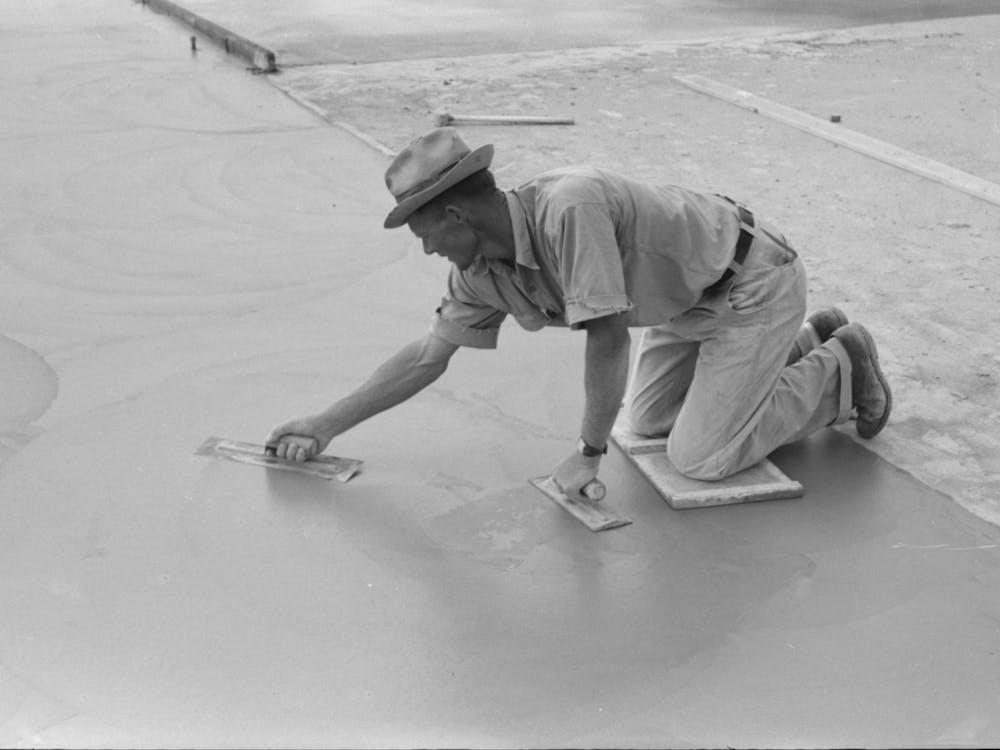 Smoothing Concrete Floor At Migrant Camp Under Construction At Sinton, Texas By Russell Lee