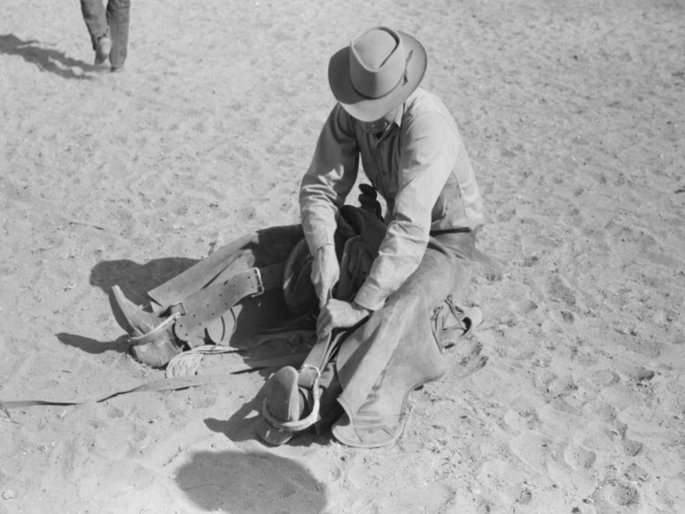 Cowboy Testing Stirrups At Rodeo Before Broncbusting, Quemado, Mew Mexico By Russell Lee