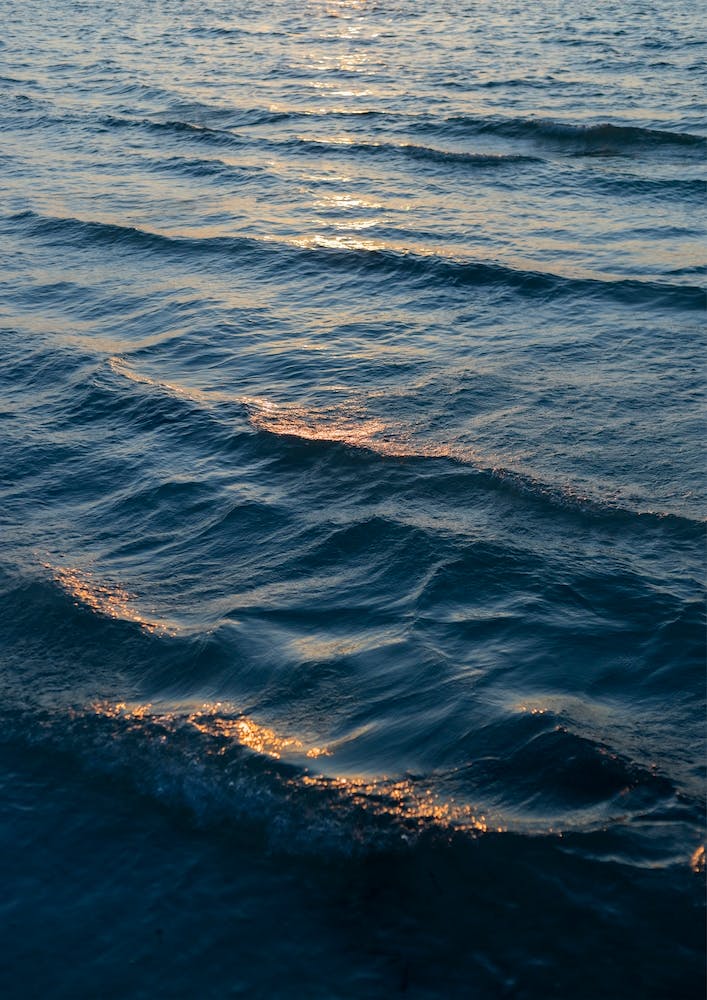 Ocean Waves And Orange Sunlight