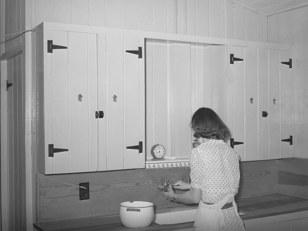 Wife Of Member Of The Casa Grande Farms Working At Her Kitchen Sink, Pinal County, Arizona By Russell Lee