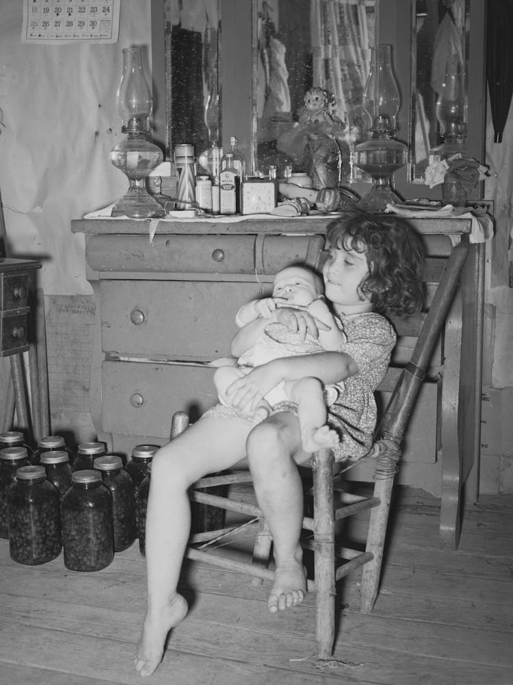 Daughter Of White Tenant Farmer Taking Care Of Her Baby Sister In Her Home In Mcintosh County, Oklahoma By Russell