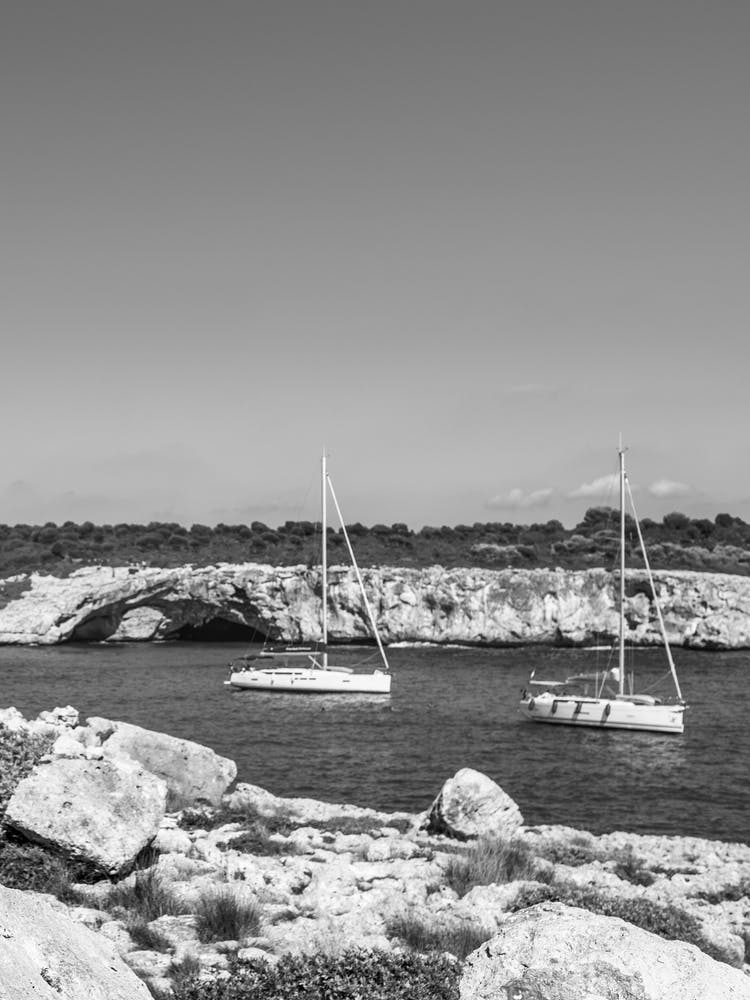 Black And White Sailboats On The Beach
