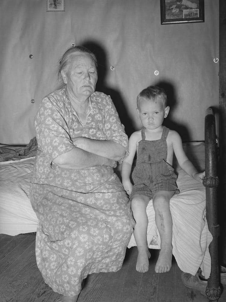 Woman Tenant Farmer With Her Grandson,Her Husband Is Dead And She Is Farming With The Help Of Three Near